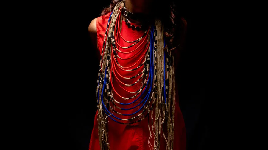 Beaded necklaces over red fabric